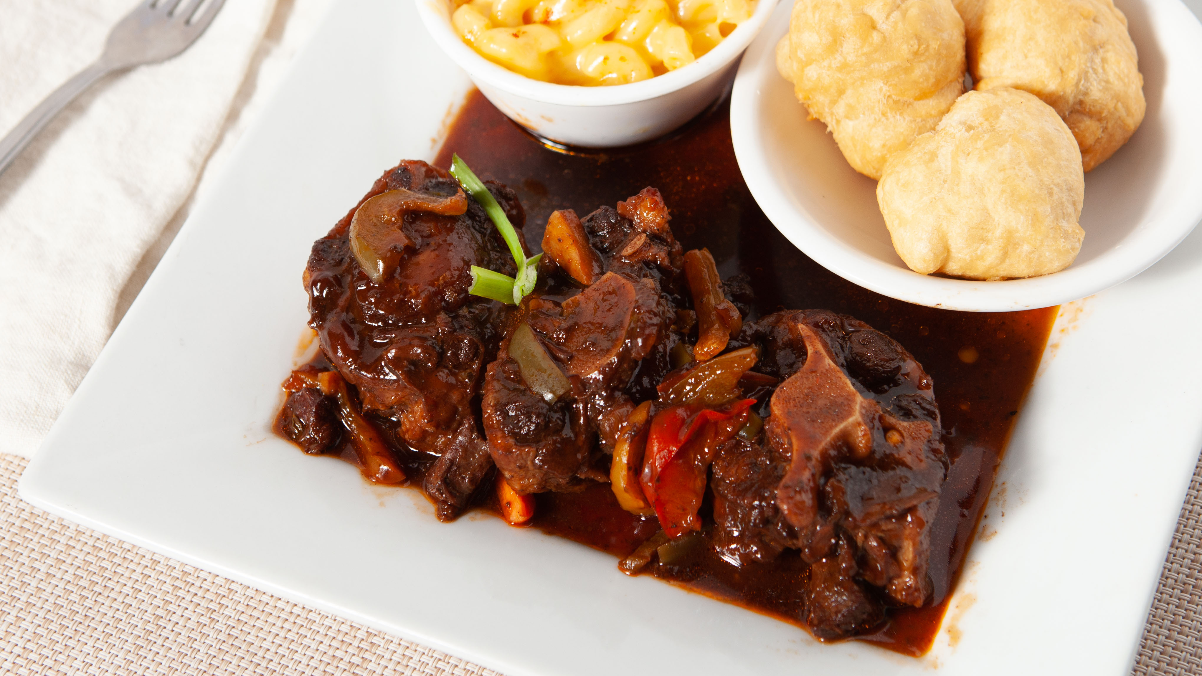 Order Oxtail Stew food online from Spice Island Grill store, Colorado Springs on bringmethat.com