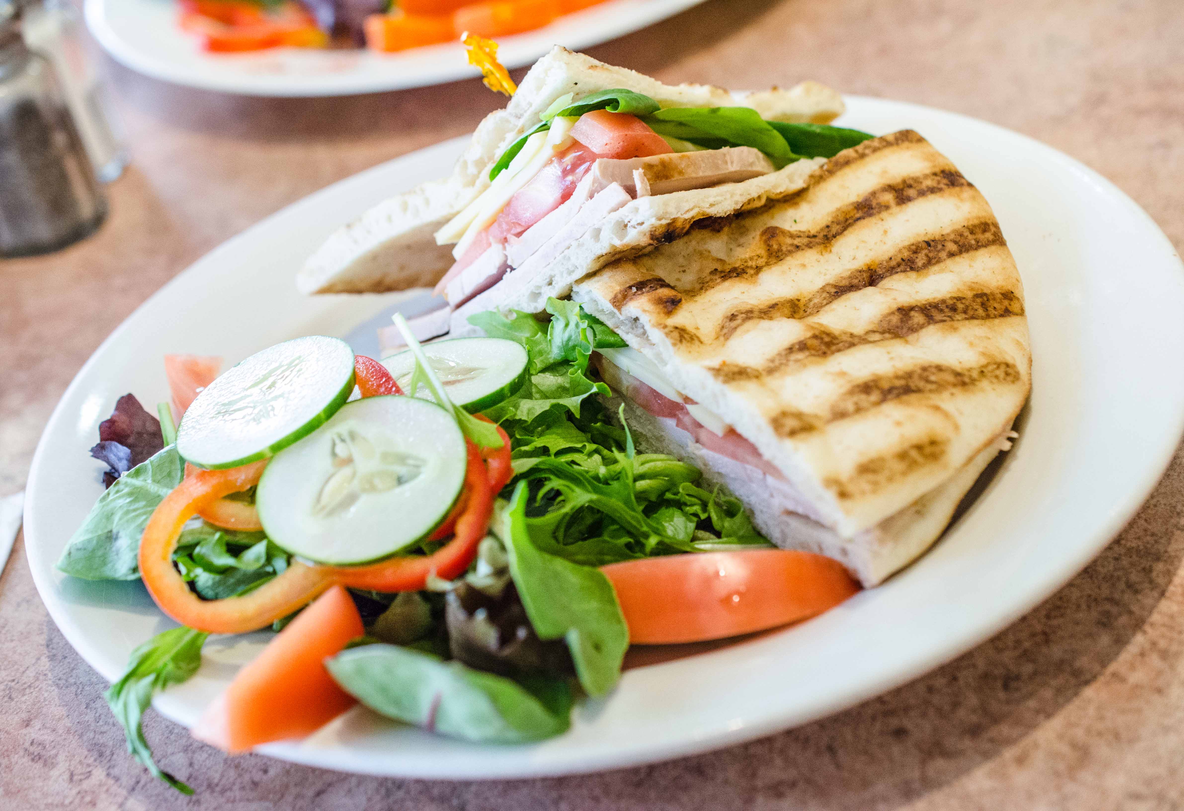 Order Turkey Panini food online from Sutton cafe store, New York on bringmethat.com